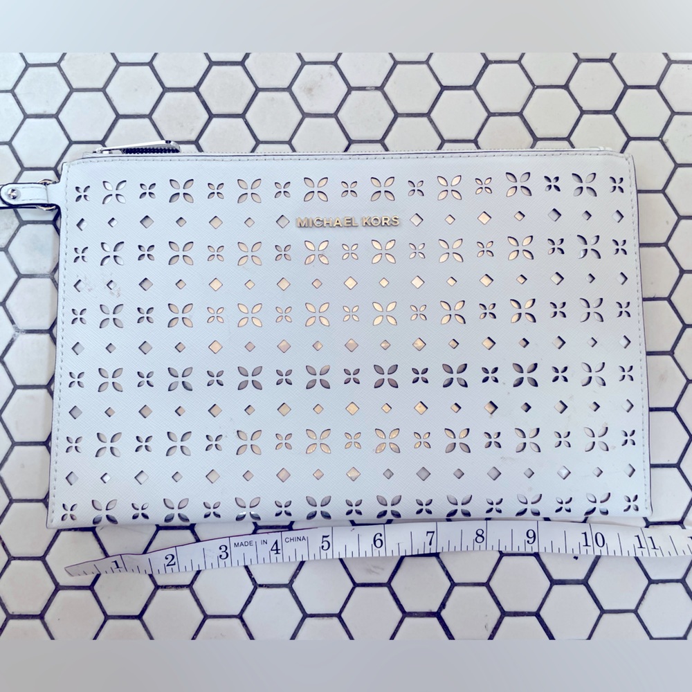 Michael Kors Laser Cut White and Silver Floral Wristlet Clutch